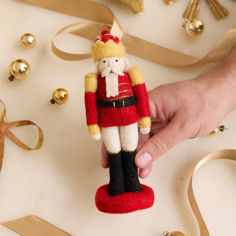 Handmade felt Christmas ornament from Craftspring’s Nutcracker Collection, featuring a classic nutcracker from the Nutcracker ballet—heirloom-quality holiday decor, ethically crafted by artisans in Kyrgyzstan using sustainable wool.