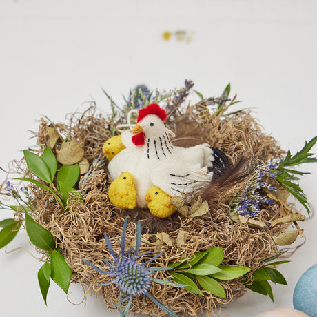 Sweet felt ornament of Mama Clucky the hen with baby chicks, symbolizing springtime love and renewal.