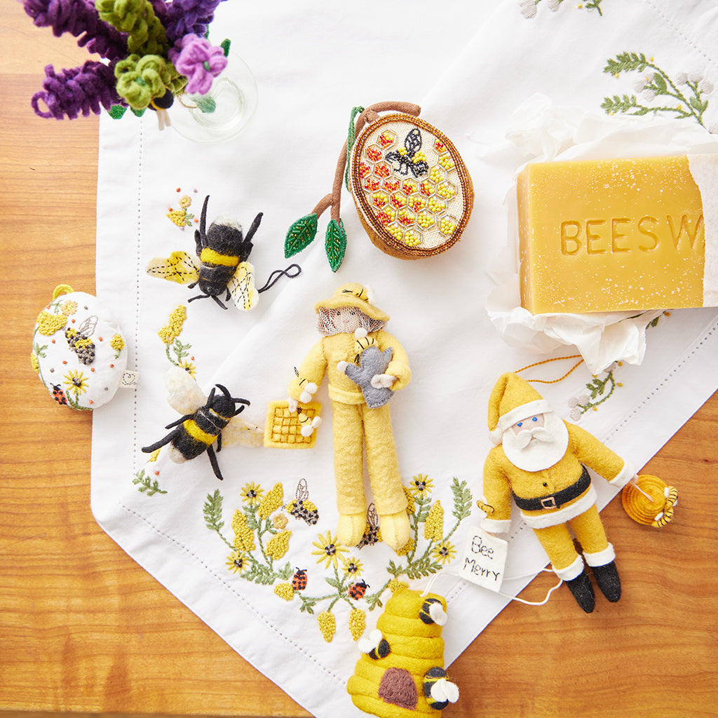 Handmade beehive ornament honoring pollinators, ideal for spring celebrations