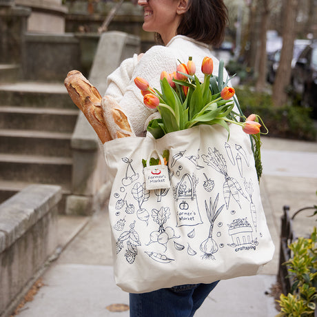 Line art of Craftspring ornaments including strawberries, carrots, peas, garlic, corn, and berries – screen printed on cotton canvas tote.
