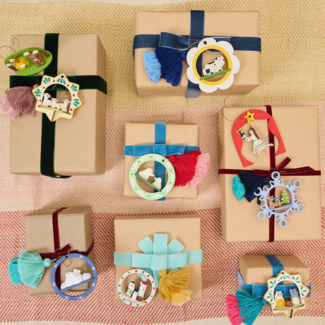 Handcrafted ornament made from wood and locally sourced clay with attached hanging string