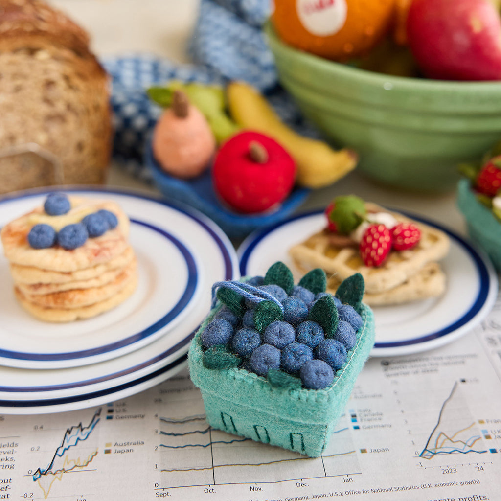 Felt blueberry pint ornament with hand-felted blue berries in a soft green wool basket. Handmade from natural wool felt using traditional needle-felting. Fair trade and ready to hang.