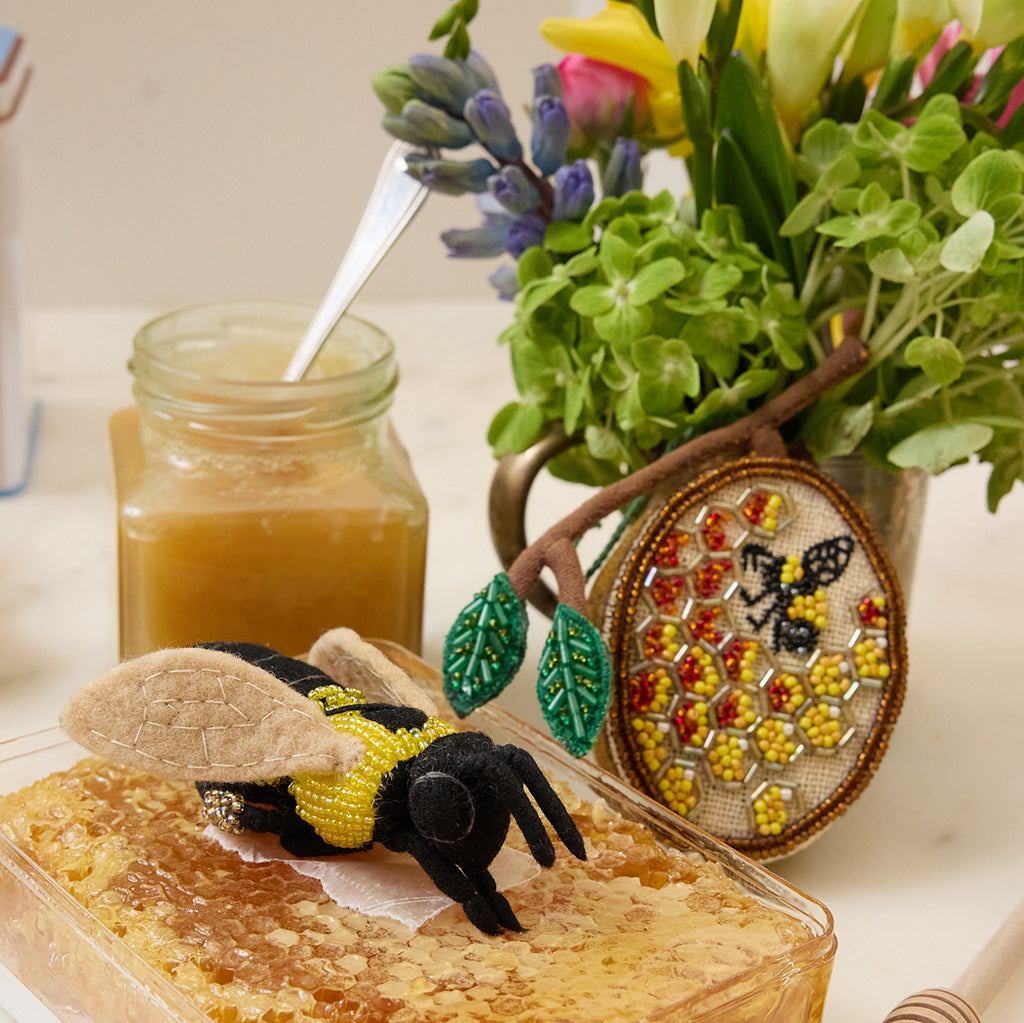 Golden beehive ornament symbolizing sweetness, abundance, and new beginnings