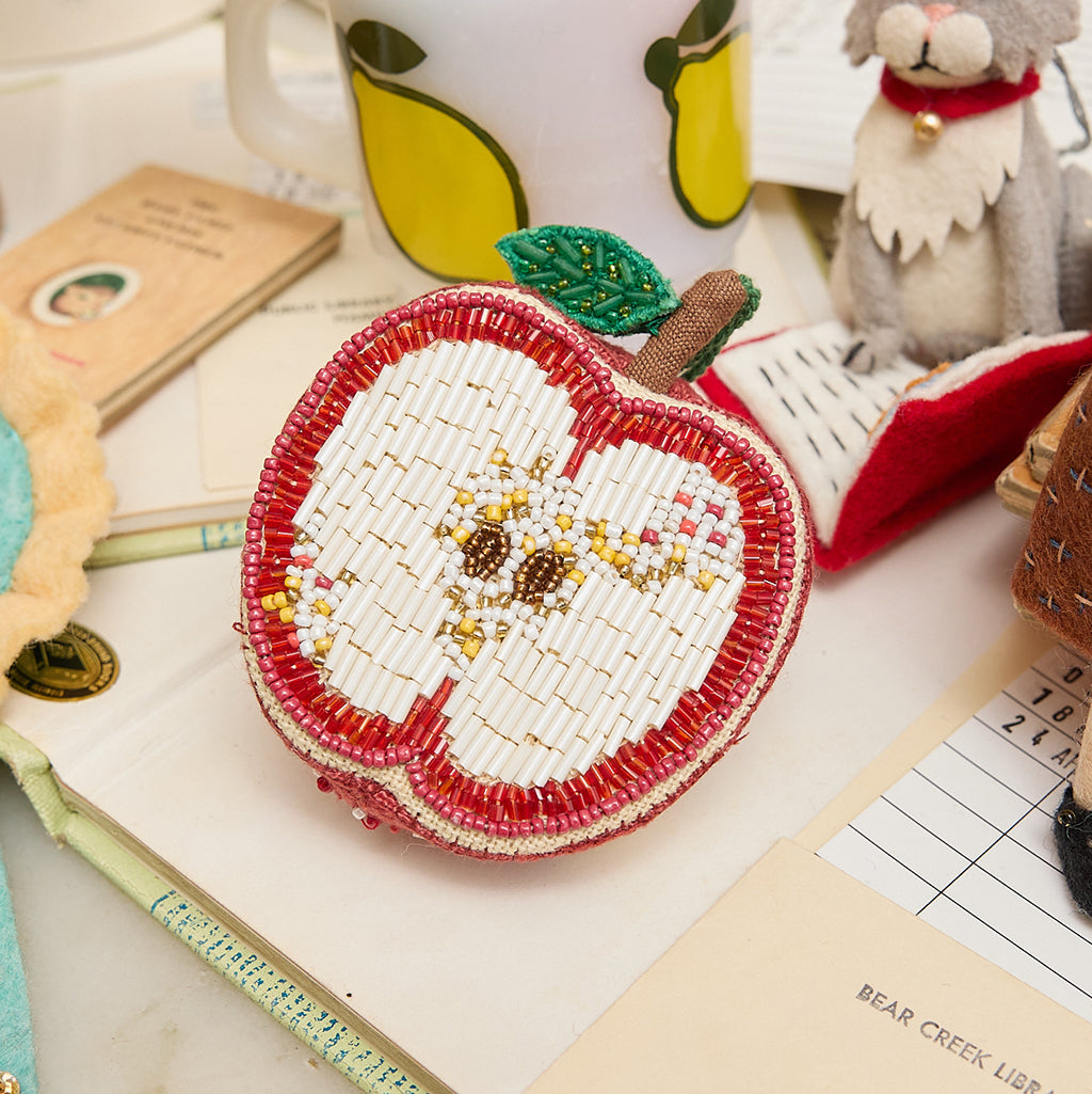 Handmade beaded apple ornament with shaded beadwork and leaf detail, crafted from cotton-linen blend. Ideal for teacher appreciation, autumn décor, or Jewish New Year celebrations.