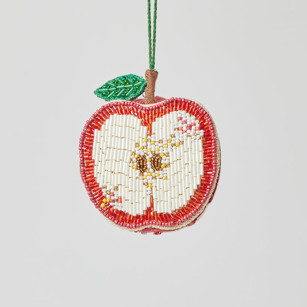 Beaded apple ornament with red and gold detail, handmade and fair trade.