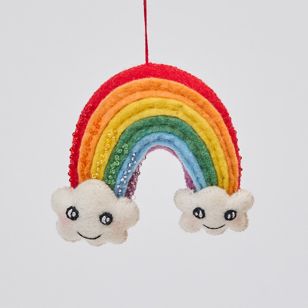 Handmade felt Cute You & Me Rainbow ornament from Craftspring, featuring intricate beaded and embroidered details with cute faces on clouds—showcasing artisan craftsmanship and heirloom quality, ethically crafted by artisans using sustainable wool.