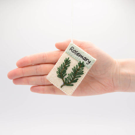 Handmade herb seed packet ornaments in felt—basil, chives, and rosemary with growing instructions