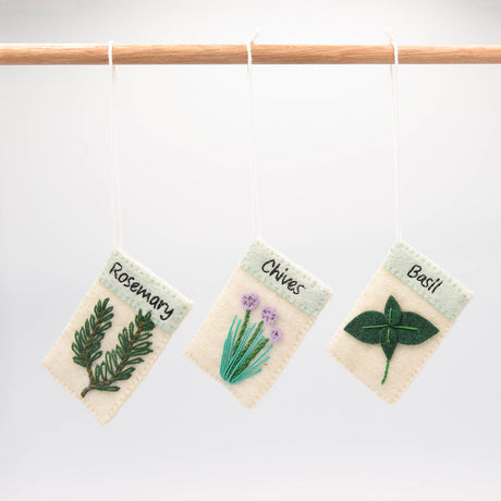 Set of three felt herb ornaments styled like seed packets—eco-friendly and handcrafted