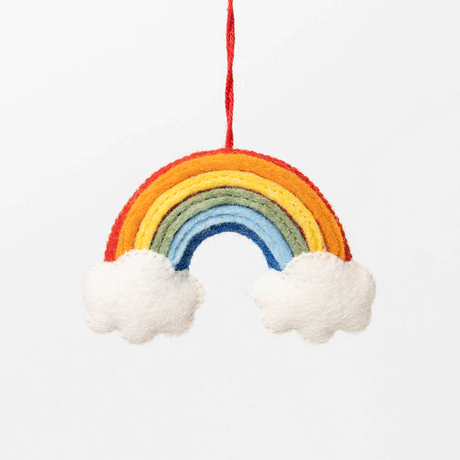 Felted wool rainbow ornament featuring vibrant arcs of color, perfect for nursery décor, office desks, or Pride celebrations.