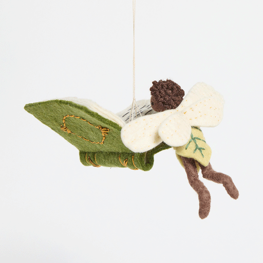 GIF 360 degree view of a reading fairy ornament, featured in Reading-themed gift bundle featuring four handmade wool felt ornaments—a gnome reading a book, a lion with glasses holding a book, a young girl reading, and a fairy with wings reading—alongside a coordinating stationery set. Stationery includes a notepad, four illustrated notecards with envelopes, and four colorful bookmarks, all featuring characters from the Reading Collection.