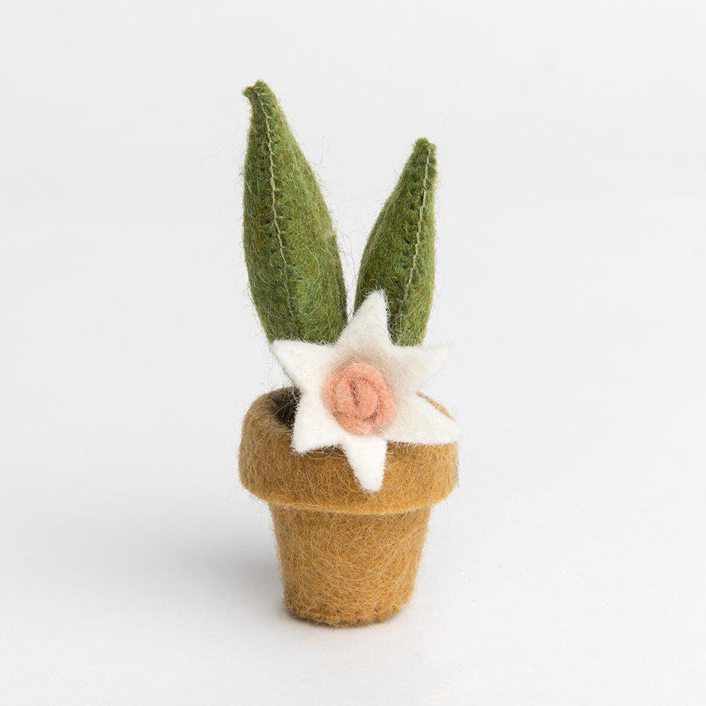 A craftspring handmade felt snake plant ornament in a small tan pot with two green leafs and a little white flower.