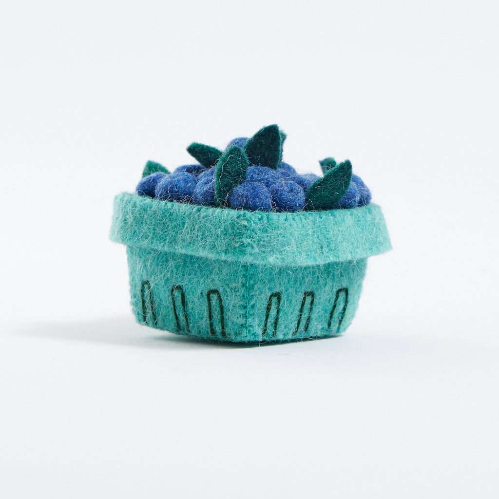Felt blueberry pint ornament with hand-felted blue berries in a soft green wool basket. Handmade from natural wool felt using traditional needle-felting. Fair trade and ready to hang.