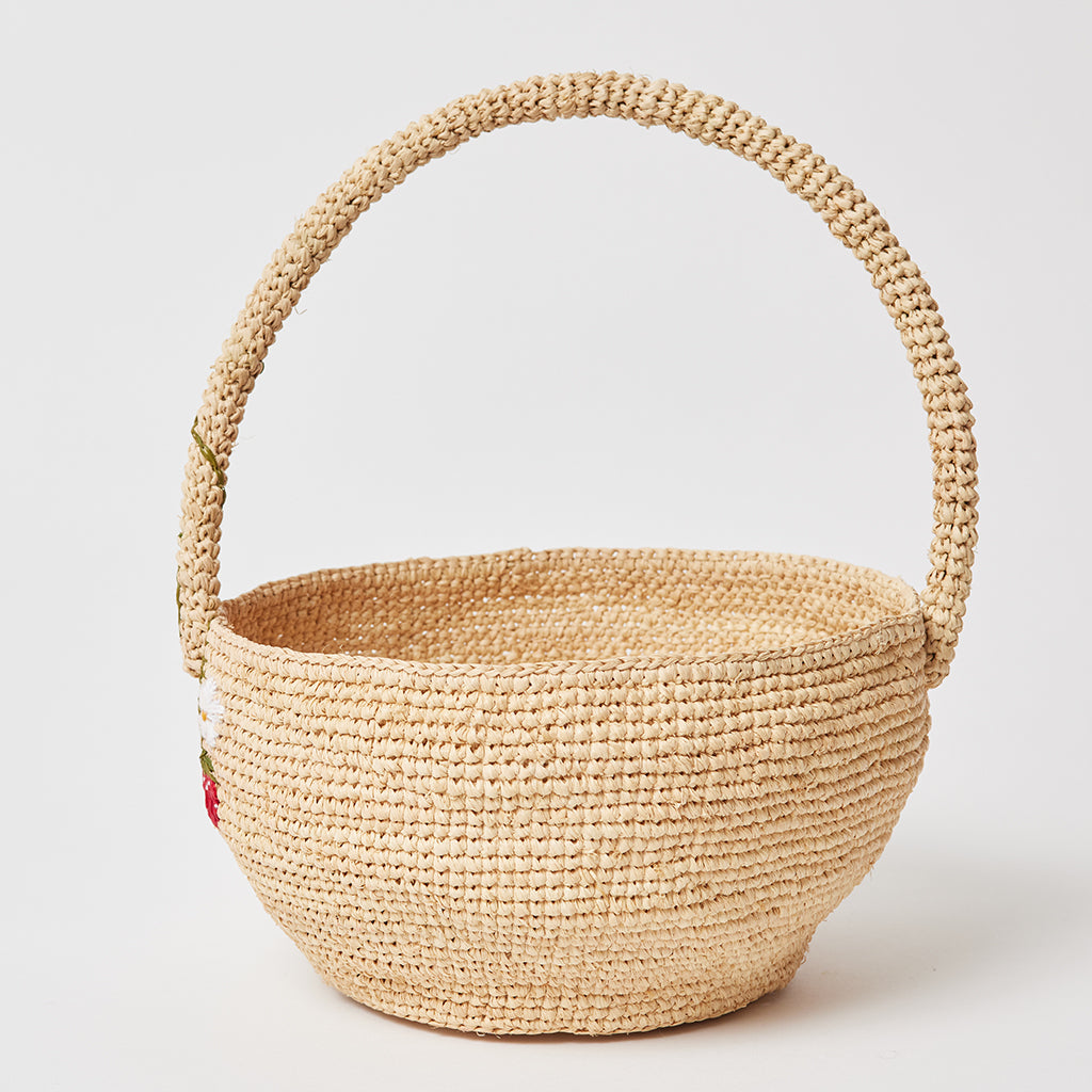 Cute spring basket with stitched strawberries and flower detail, handcrafted from natural raffia.