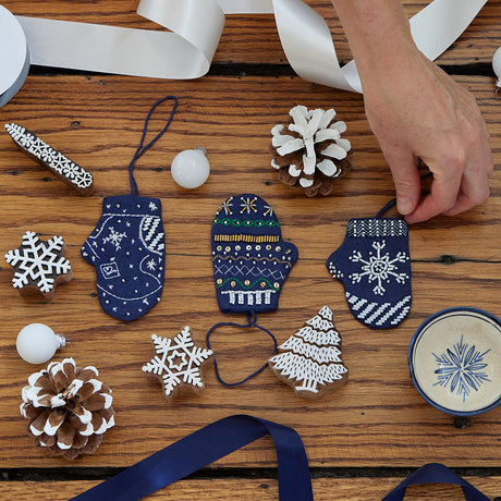 Mini mitten ornaments from Craftspring’s Christmas in July Sale, with beaded and embroidered details—displayed with ribbons, pinecones, and snowflakes, perfect for early holiday gifting, sustainably handmade by artisans.