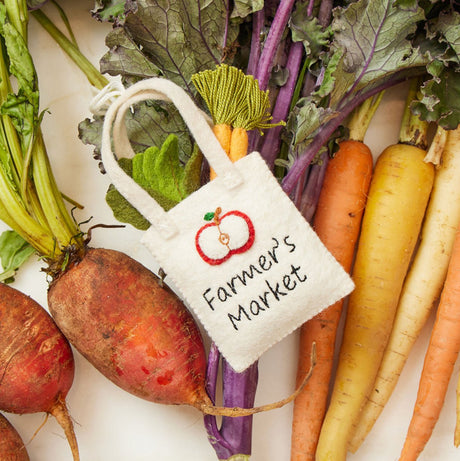 Handmade felt ornaments from Craftspring’s Farmer’s Market Collection, with farmers, bunny, tote, and vegetables—ethically crafted from sustainable wool.