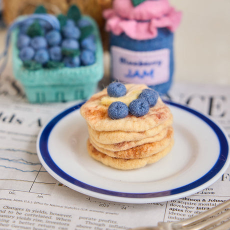 Handmade felt Blueberry Pancake Stack and Blueberry Pint ornaments from Craftspring’s Best of the Best Collection—charming Christmas decor and thoughtful holiday gifts, ethically crafted by artisans using sustainable wool.