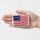 Honor the spirit of 1776 with our handcrafted 1776 American Flag Ornament from the Craftspring Semiquincentennial Collection. Inspired by the early American flag associated with the Revolutionary era, this felt ornament features embroidered red and white stripes, a blue canton with stars, and the year “1776” stitched proudly across the center—commemorating the birth of the United States. 