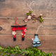 Felt sake pitcher and cups ornament with sakura design, handcrafted from natural wool by artisans in Kyrgyzstan. Japan-inspired spring décor.