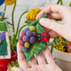 Ladybird garden ornament made from merino-blend wool, featuring hand-felted detail and grape accents—ideal for gifting or botanical holiday décor

