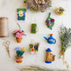 Handcrafted felt Gardening Collection ornaments – bees, herbs, vegetables, and garden critters made from sustainable wool.