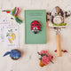 Soft wool felt bluebird nesting in a cozy handmade nest – perfect spring decoration symbolizing new beginnings.