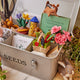 Whimsical felt tool bag ornament with garden gloves and fresh veggies for seasonal decor