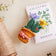 Handmade Spring Crocus ornament in soft wool with detailed bugs and vibrant crocus flowers, ideal for gardening lovers and nature-themed décor