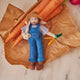 Hand-felted farmer ornament holding white bunny and felt carrots – wool spring decor from the Gardening Collection.