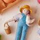 Fair trade wool ornament of female farmer with chicken – handmade in Kyrgyzstan from natural felted wool.