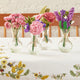 Sustainable hyacinth bouquet with felted bees and wire stems in a delicate glass vase