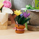 Felt crocus flower pot ornament with handcrafted insects and playful springtime details, made from merino-blend wool and fairly traded from Kyrgyzstan