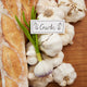 Rustic garlic ornament with felted detail – part of handcrafted Gardening Collection celebrating flavor and harvest.