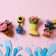 Spring Garden Splash Ornament Set – handcrafted felt flower pots, rain boot, and spring blooms made from sustainable wool.