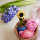 Hand-felted sunflower in blue wool pot – handcrafted ornament with beaded accents from the Gardening Collection.