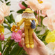 Hand-felted beekeeper ornament with amber hair and fair complexion, wearing protective suit