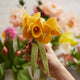 Ethically handmade daffodil bouquet with felt flowers and eco-friendly glass vase.