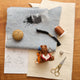 Handmade felt ornament featuring a cozy scene with a bear reading a book to friends design process from sketch to felt. Crafted from eco-friendly wool, this ornament captures the magic of shared reading and childhood adventures. A heartwarming gift for book-loving families, young readers, and those who cherish the joy of storytelling. Ready to hang with a string attached, it adds a whimsical touch to holiday trees and reading spaces.