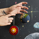Hand-felted Planet Earth ornament set showing Earth’s surface and a cross-section of its inner layers. Educational, handmade wool ornaments for science lovers.

