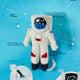 Hand-felted astronaut ornament with jetpack and space suit, celebrating space exploration and science. Handmade wool decoration, fair trade.

