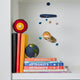 Felt Earth ornaments showing globe and interior layers, handmade and educational.

