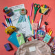 Handmade felt reading badge surrounded by school supplies shaped like a ribbon with shimmering star details, designed to celebrate young readers' achievements. Crafted from merino-blended wool, the badge comes pinned to an illustrated postcard with space for a personal message, and includes an envelope for gifting. Features both a safety pin and a hanging loop. A fun, motivational keepsake for children, perfect for classrooms, libraries, or reading milestones.
