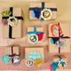 Handcrafted ornament made from wood and locally sourced clay with attached hanging string