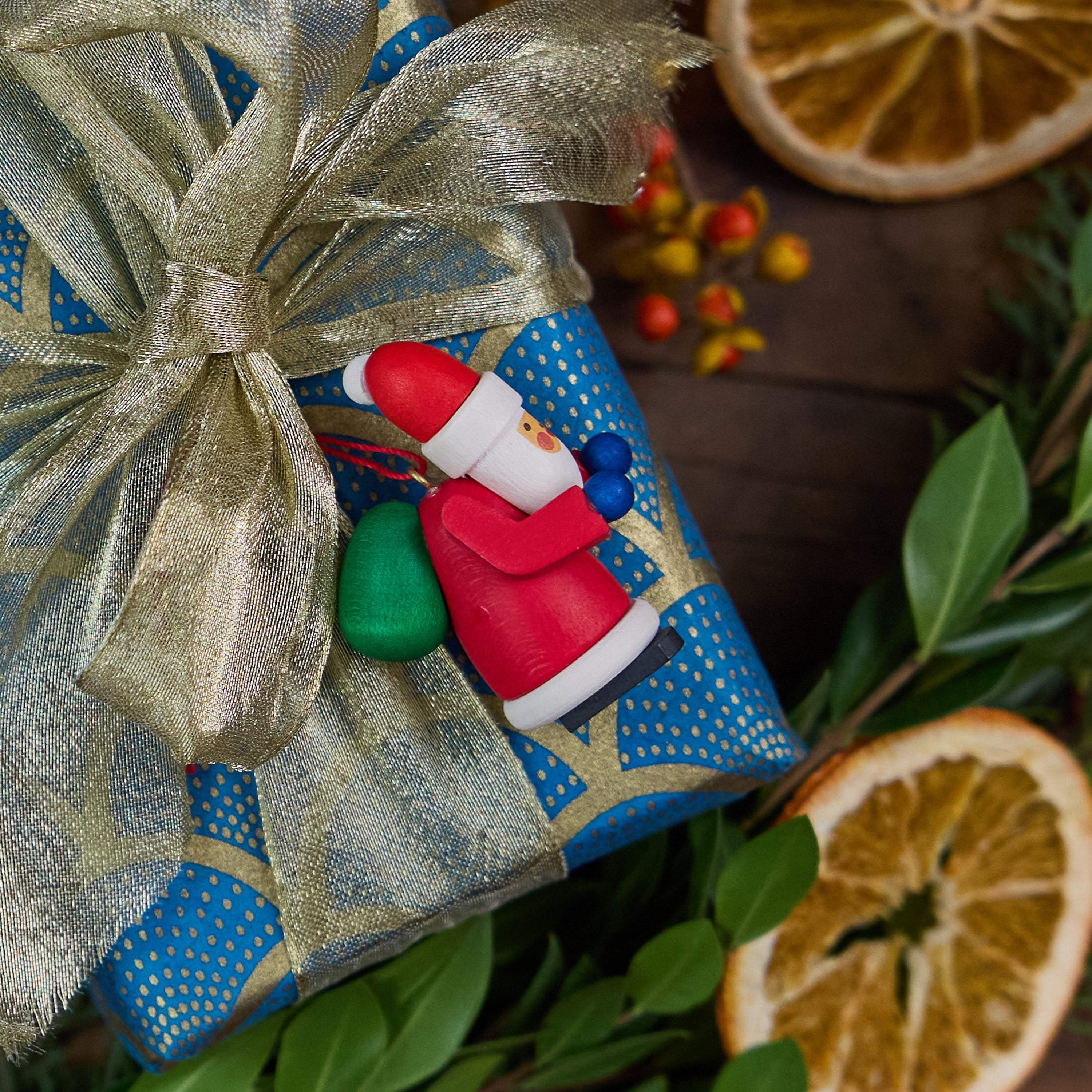 Handmade Wooden Red Santa Holding Green Sack on its Back Ornament