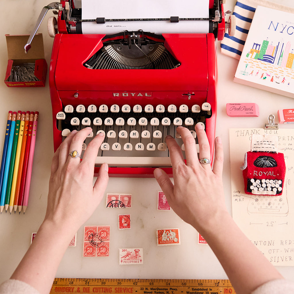 Vintage-inspired red typewriter ornament handcrafted from felted wool, based on the 1955 Royal Quiet De Luxe. Great gift for authors, poets, and creatives.