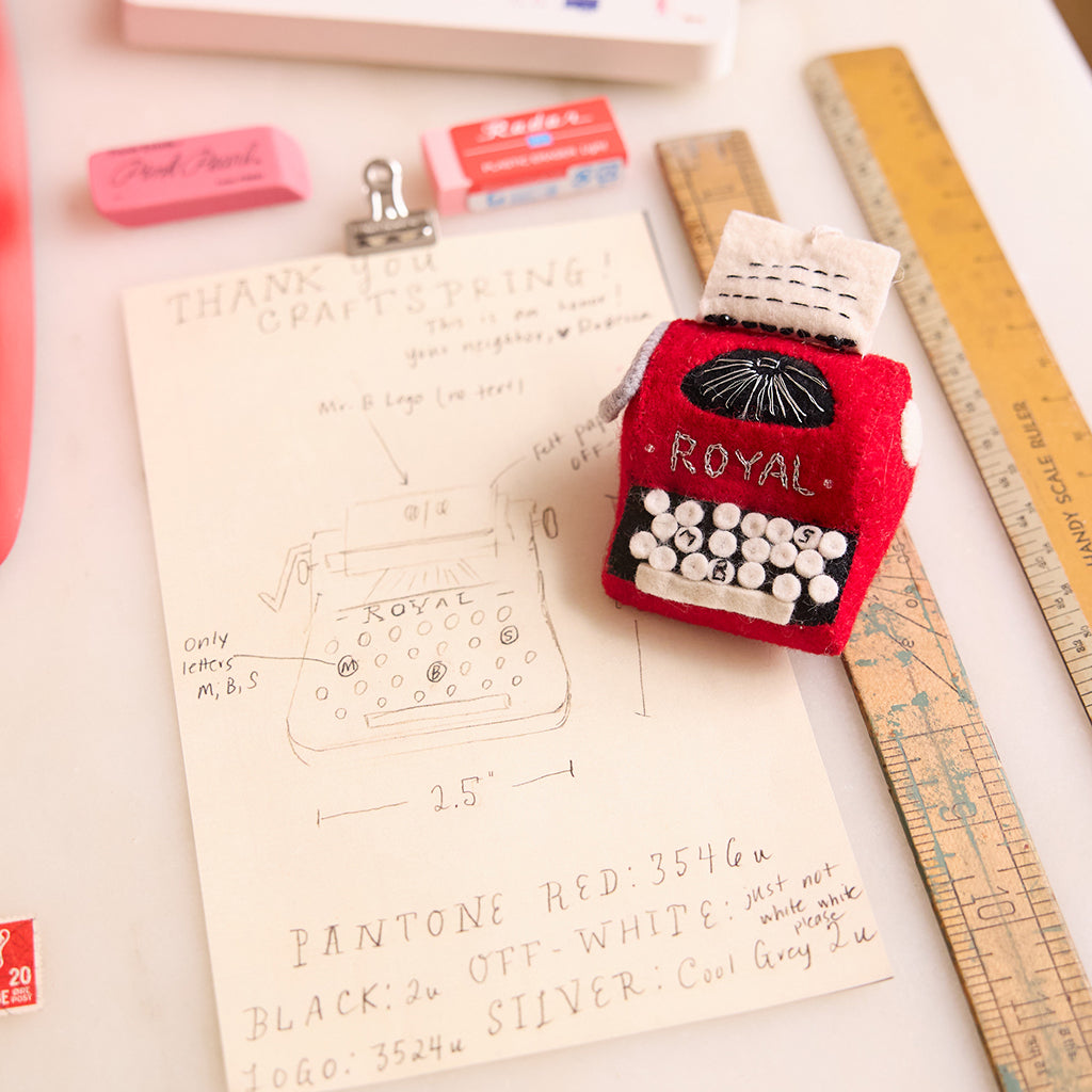 Felt red typewriter ornament with stitched keys, handmade and fair trade. Design process 
