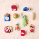 Handmade felt ornaments of NYC iconic places including one shaped like The Strand Bookstore tote bag, complete with the embroidered red logo and a tiny felt NYC guidebook tucked inside. Crafted from soft tan wool felt, this miniature tote is filled with colorful hand-felted books, paying tribute to the legendary NYC bookstore. A perfect gift for Strand fans, NYC lovers, and book enthusiasts, adding a literary touch to holiday trees or bookshelves.

