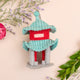 Hand-felted Asian-style pagoda ornament with jade roof and vermillion pillars, inspired by traditional East Asian architecture. Handmade and fair trade.


