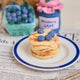 Felt pancake stack ornament topped with hand-felted blueberries and a yellow butter square. Handmade from natural wool felt using needle-felting. Fair trade and ready to hang.