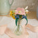 Handcrafted felt wildflower bouquet with tiny snail in recycled glass bud vase