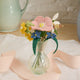 Handcrafted felt wildflower bouquet with tiny snail in recycled glass bud vase